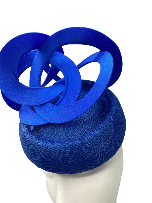 Blue headpiece with blue swirl detail.